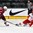 GRAND FORKS, NORTH DAKOTA - APRIL 24: Denmark's Oliver Larsen #5 passes the puck while Latvia's Erlends Klavins #18 defends during relegation round action at the 2016 IIHF Ice Hockey U18 World Championship. (Photo by Matt Zambonin/HHOF-IIHF Images)

